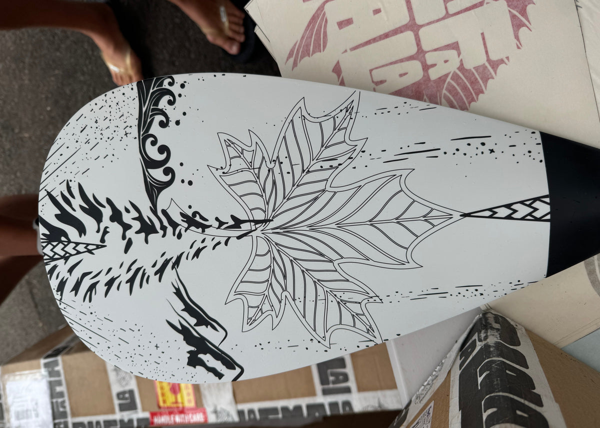 white paddle with black line work
