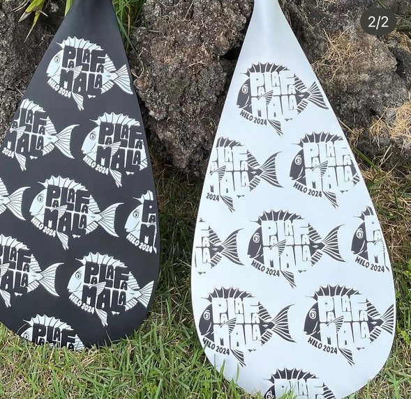 white and black paddles with palafamala logos
